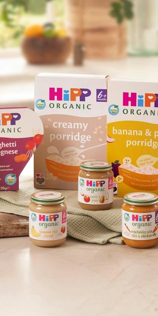 A range of HiPP Organic baby food and milk products on a kitchen worktop