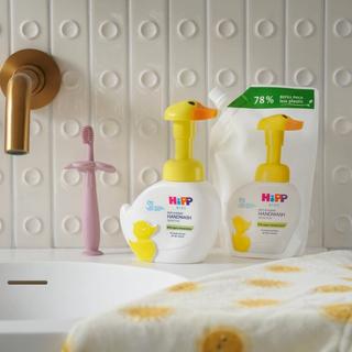 HiPP Kids soft & foamy handwash duck refill on a sink next to a tap and handtowel
