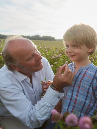 Stefan Hipp and son in a field