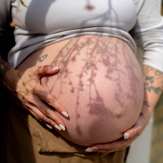 Woman's bump with flower shadow