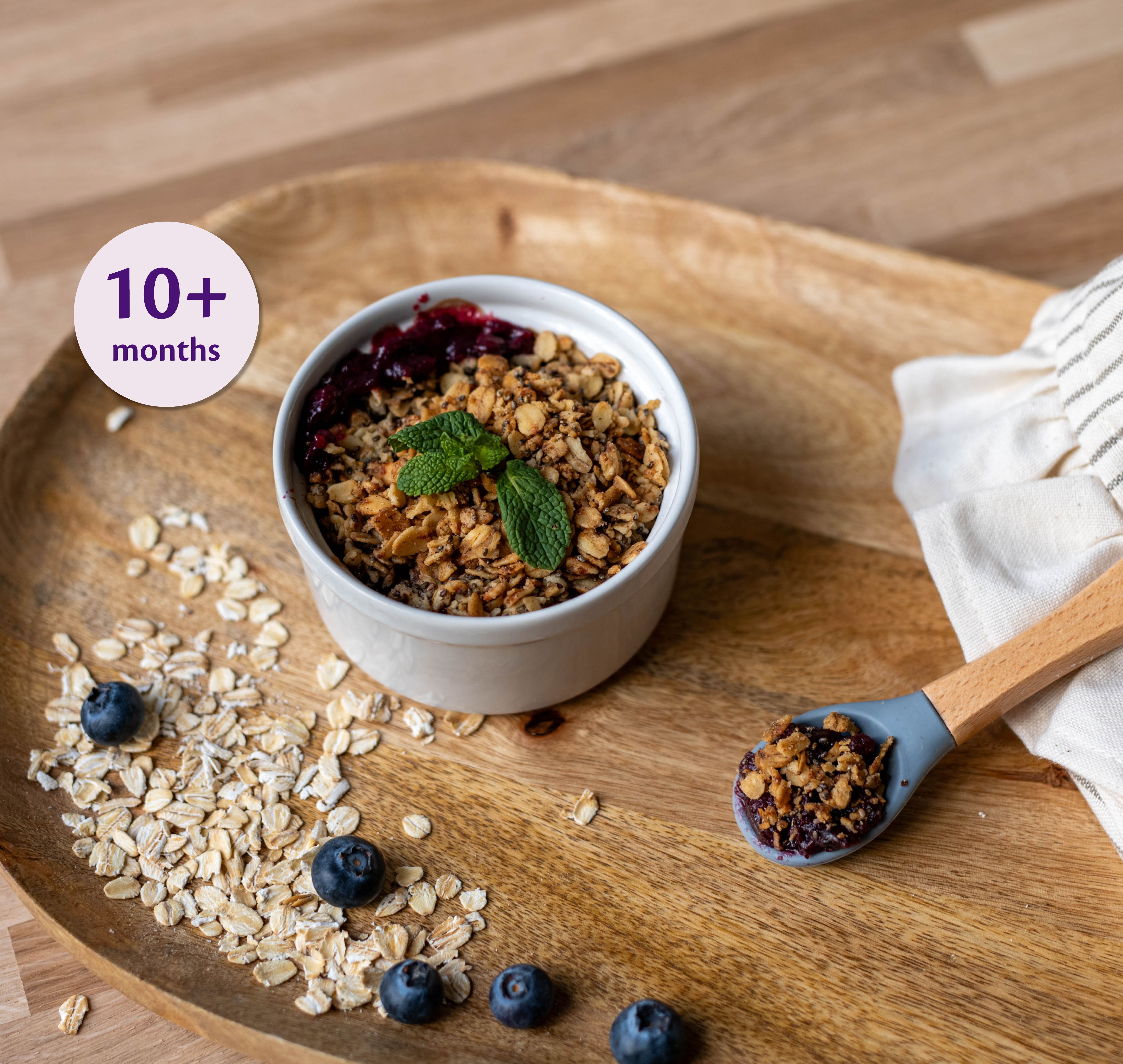 Apple, Blueberry & Pear Crumble served in a bamboo bowl