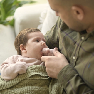 Dad with newborn baby