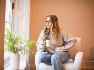 Expecting mum at early stages of pregnancy drinking a ginger and lemon tea