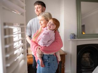 Family looking out a window