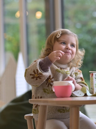 Toddler eating snacks
