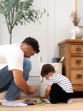 Dad and son playing with Lego together