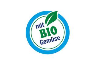 Rundes Siegel mit grünem Blatt und Aufschrift „mit BIO Gemüse“ als Hinweis auf hochwertige Bio-Zutaten.