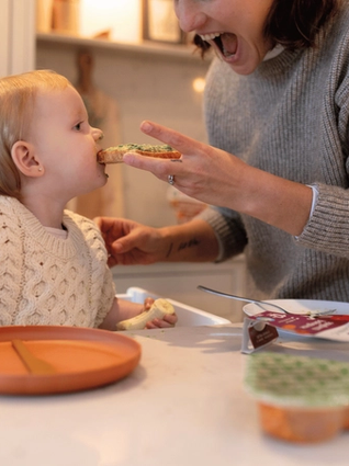 Mum feeding baby