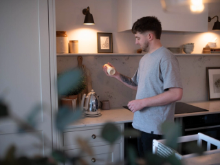 Dad preparing a bottle of follow on milk