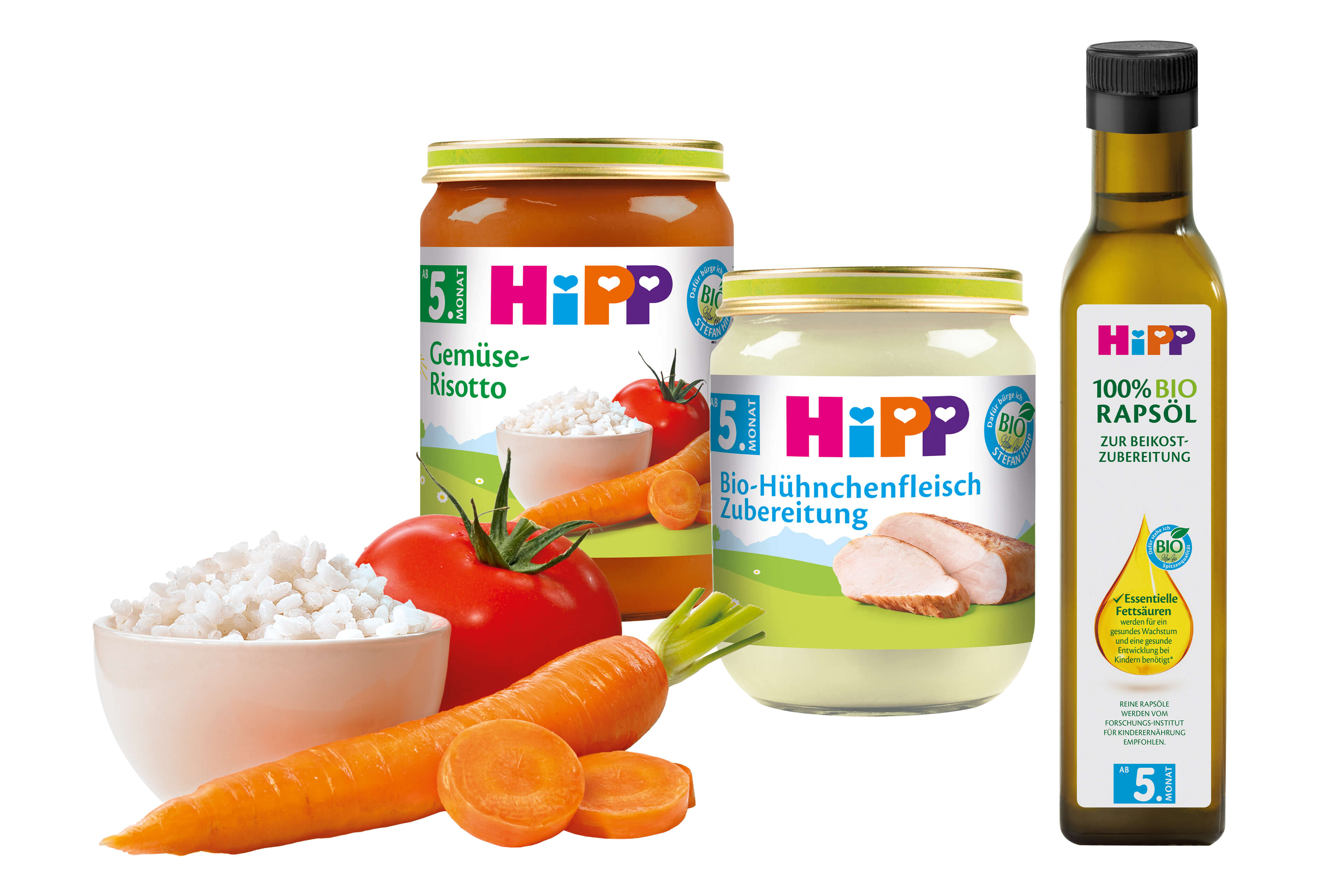 Eine Reihe von Babynahrungsprodukten der Marke "Hipp", begleitet von einer Flasche Olivenöl mit der Aufschrift "100% Bio Rapsol".