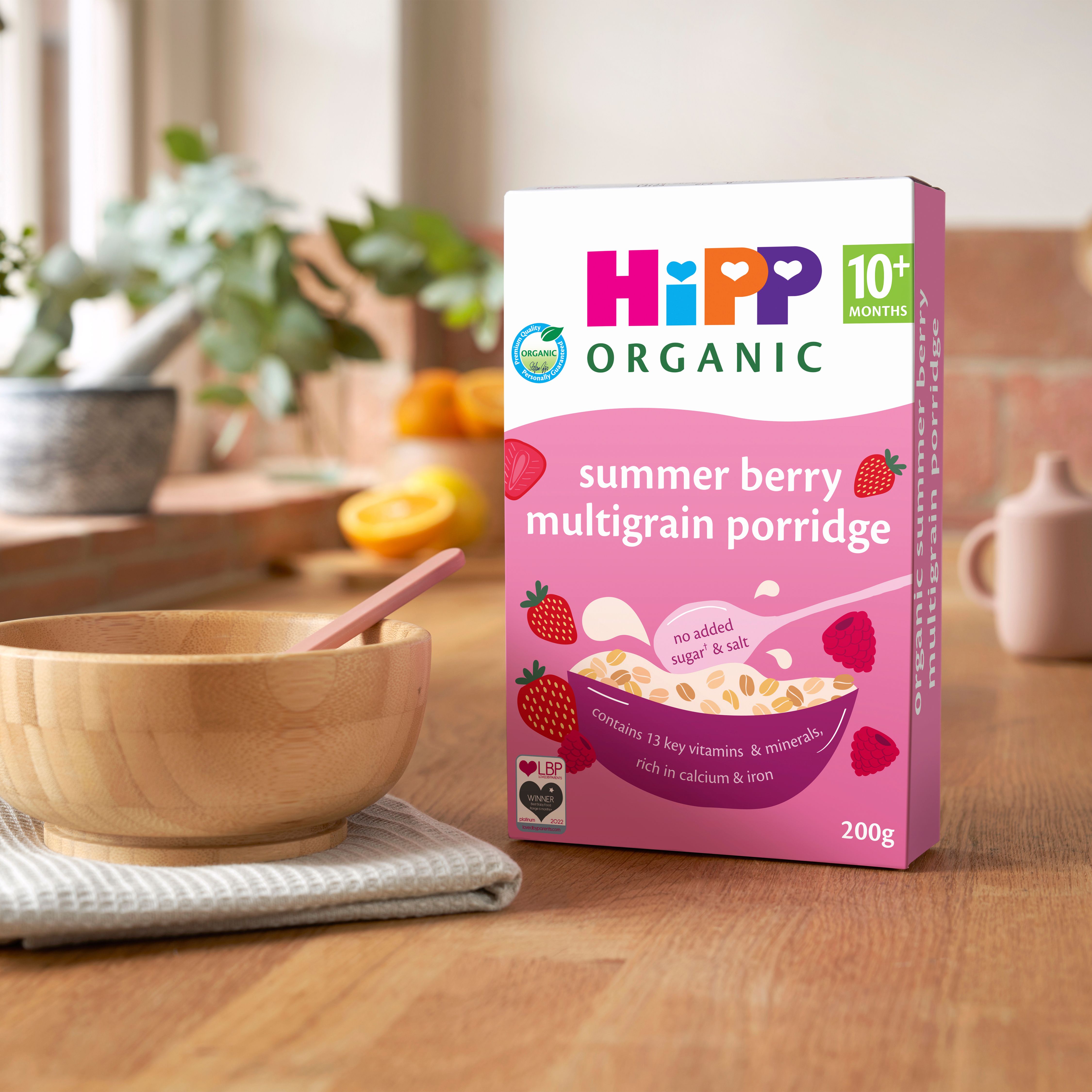 HiPP Organic Summer Berry Multigrain Porridge on a breakfast table