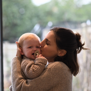 Mum soothing crying baby