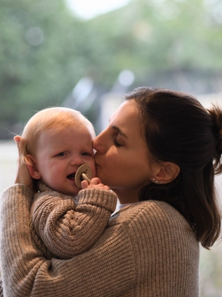 Mum soothing crying baby