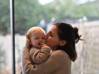 Mum soothing crying baby