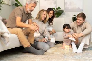 A family sat together in a living room
