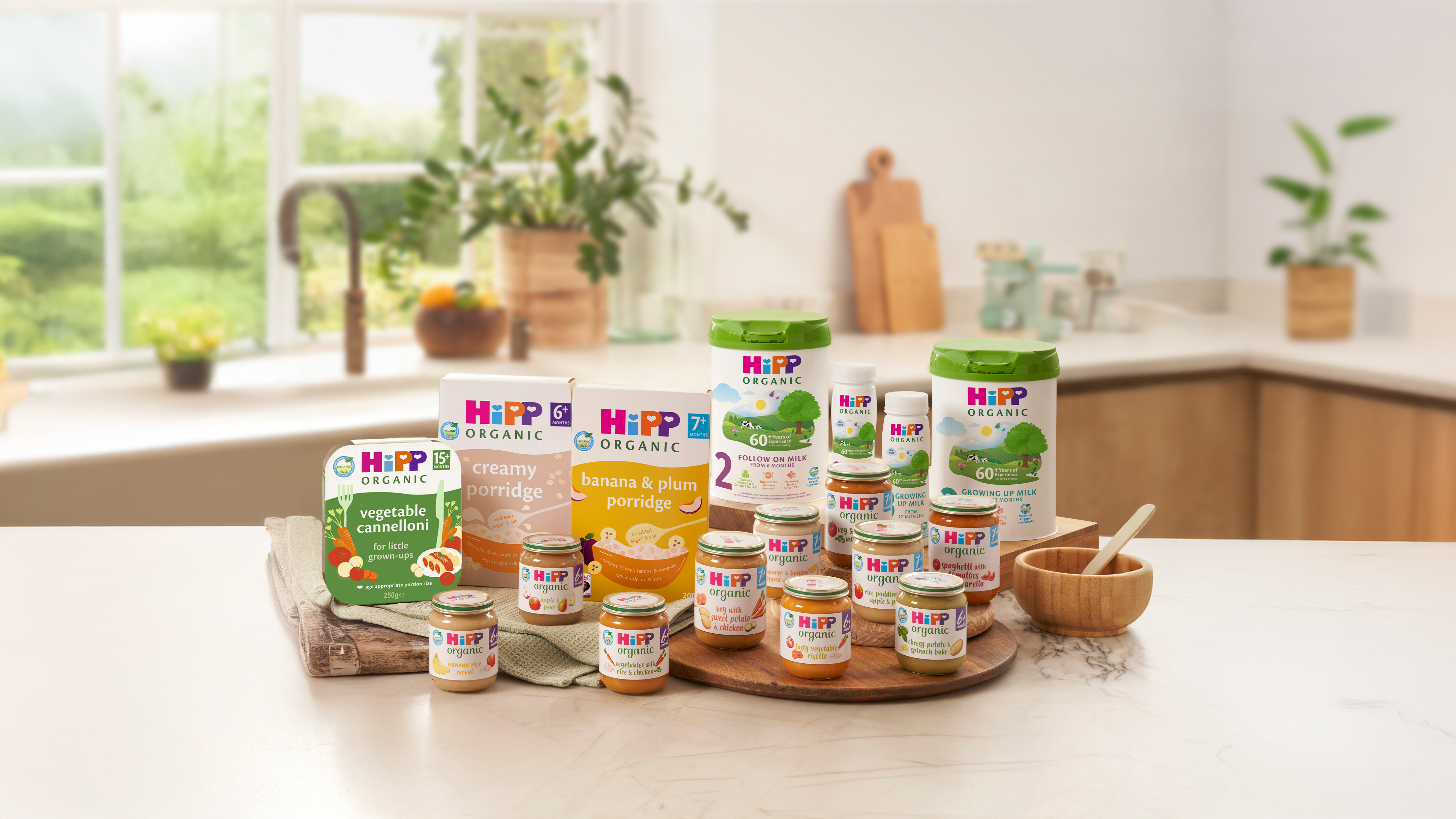 A range of HiPP Organic baby food and milk products on a kitchen worktop