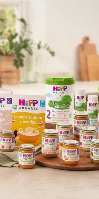 A range of HiPP Organic baby food and milk products on a kitchen worktop