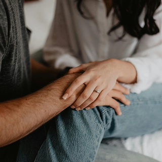 Two people holding hands
