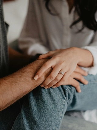 Two people holding hands