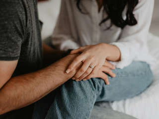 Two people holding hands