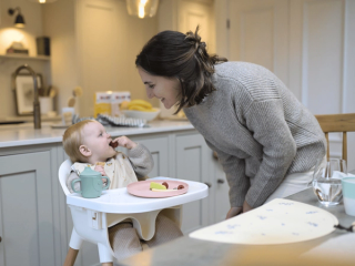 Mum and baby eating fruit