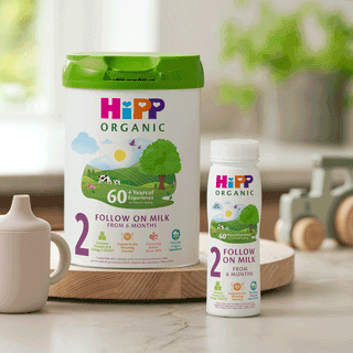 HiPP Organic Follow On Milk Tin and Ready To Feed bottle on kitchen side