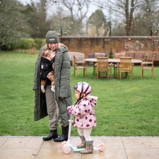 Mum walking with baby and toddler