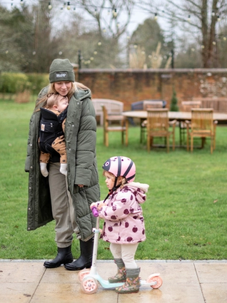 Mum walking with baby and toddler