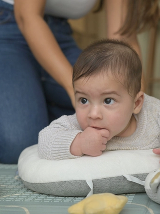 Baby chewing on his fingers