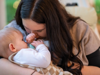 Mum cuddling with baby whilst feeding