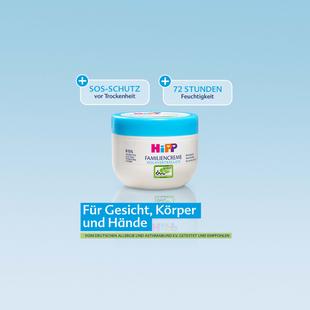 Pflegecreme-Dose mit Aufschrift "HIPP BABYPFLEGE" vor blauem Hintergrund mit Texten zu SOS-Schutz vor Trockenheit und 72 Stunden Feuchtigkeit