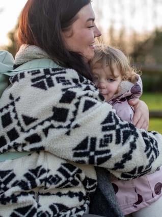 Mum hugging her toddler