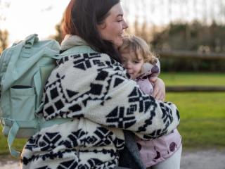 Mum hugging her toddler