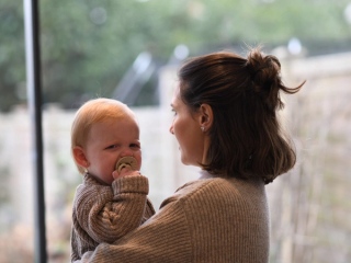 Baby upset whilst mum trying to comfort her