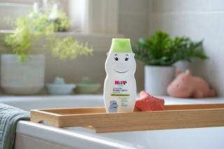 HiPP Clean & Green bubbly bath hippo on a shelf over a bath