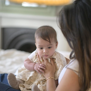 Mum winding baby
