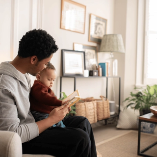 Dad reading to baby