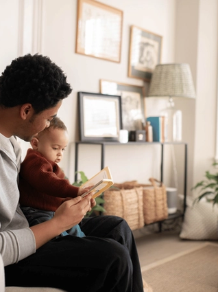 Dad reading to baby