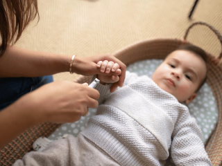 Mum trimming baby's nails