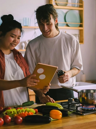 A couple that is cooking together