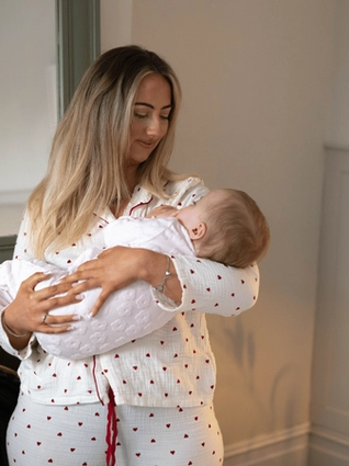 Mum rocking baby back to sleep
