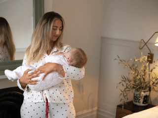Mum rocking baby back to sleep