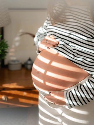 Expecting mum holding bump