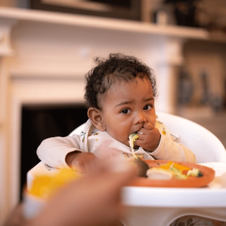 Baby eating finger foods
