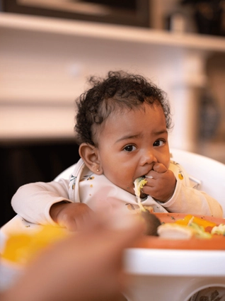 Baby eating finger foods