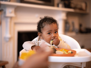 Baby eating finger foods