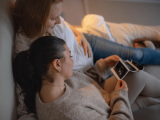 Expecting couple looking at ultrasound scan