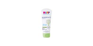 HiPP Babysanft Wundschutz Sensitiv Creme-Tube mit Bio-Mandelöl für den Windelbereich auf schwarzem Hintergrund