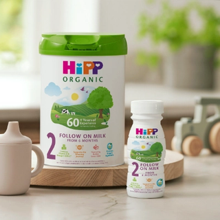 HiPP Organic Follow On Milk Tin and Ready To Feed bottle on kitchen side