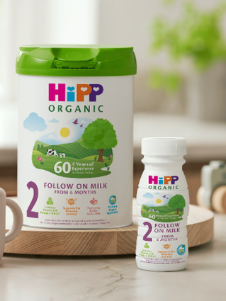 HiPP Organic Follow On Milk Tin and Ready To Feed bottle on kitchen side